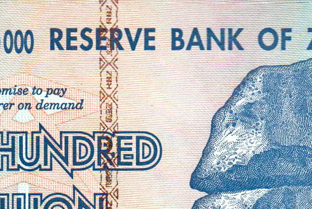 Close-up of the security stripe on a genuine Zimbabwe 100 trillion dollar note, with RBZ lettering inside a lattice pattern